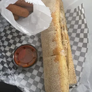 Chicken cheesesteak with provolone cheese &amp; fried onions, and mozzarella sticks