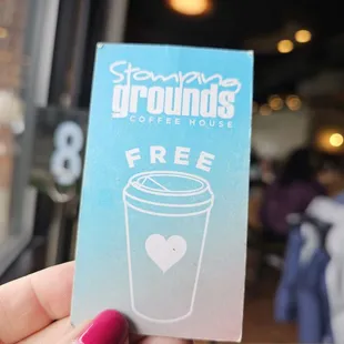 a person holding a cup of coffee