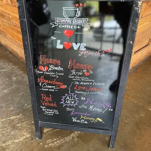a blackboard with a variety of coffees