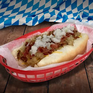 Battered and fried Nathan&apos;s frank with mustard, bacon bits, sauerkraut, and diced onion.