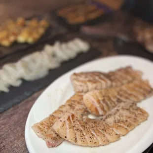 grilled fish on a white plate