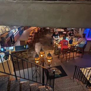 people sitting at tables in a restaurant