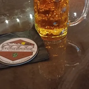 a mug of beer on a table