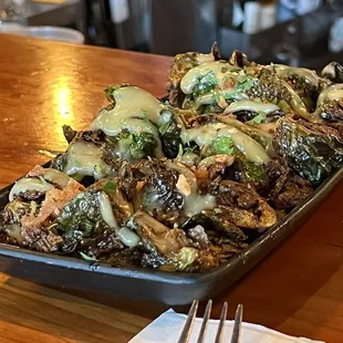 Best sprouts I&apos;ve had in a whiiiile. Crispy outside, tender I side and topped with a delectable sauce!