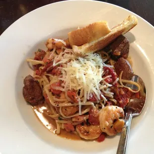 a plate of pasta with meat and cheese