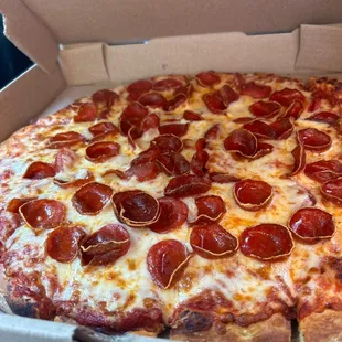 a pepperoni pizza in a box