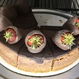 a chocolate cake with strawberries on top