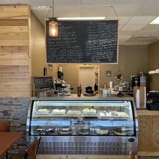 a bakery counter with pastries on display