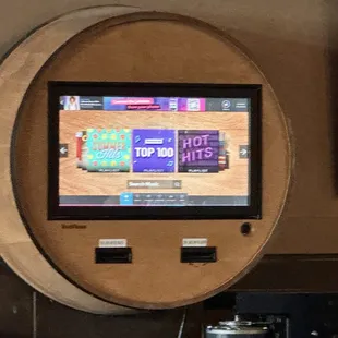 a wooden barrel mounted on the wall