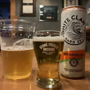 a glass of watermelon and a can of watermelon