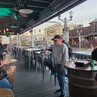 Folks smoking cigars, drinking beer and enjoying life. If you are a Karen please don't come.