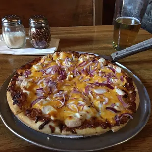 a pizza with onions and cheese