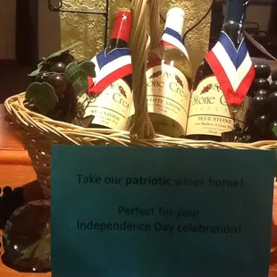 a basket of wine and grapes