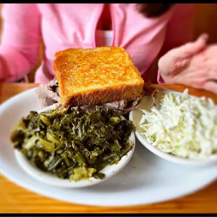 Tammy had the brisket sandwich, greens(delicious)and coleslaw with a sweet tea. $8.99!