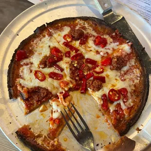 Gluten free burnt crust pizza. And the chef said " yeah, that's how they are". Really?!?  Only here is it burnt.