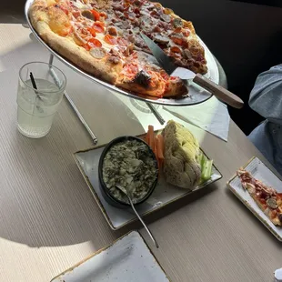 Delicious spinach and artichoke dip!  Pizza crust is light and airy with just the right amount of crunch!