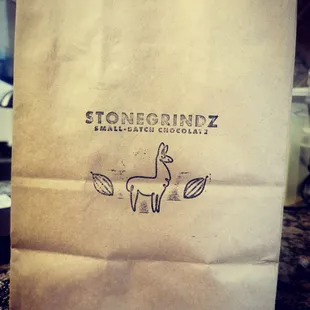 a paper bag with a logo on it