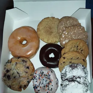 Glazed, chocolate dipoed, icing and sprinkles donuts, blueberry muffin, chocolate chip, oatmeal glazed, and chocolate powdered cookies.