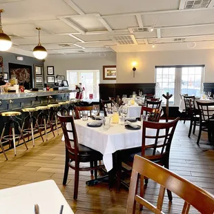 a dining room with tables and chairs
