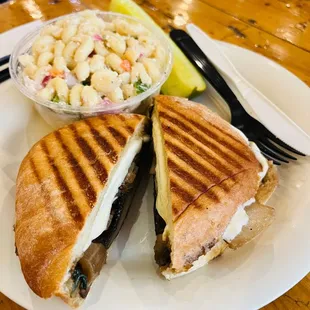 a grilled sandwich with macaroni salad