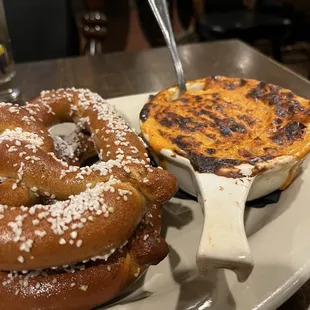 a pretzel and a pie on a plate