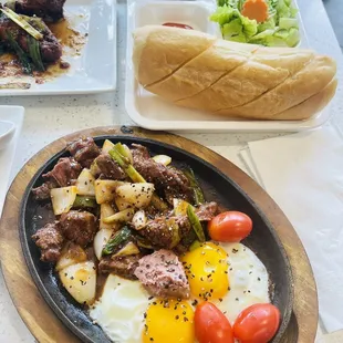 Sizzling steak and eggs