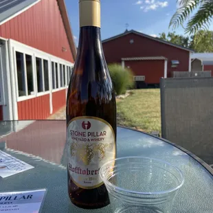 a bottle of wine and a glass