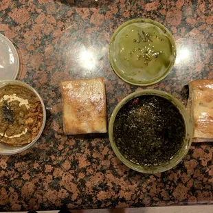 Kashke Bademjan  to the left and Shahsavar Ghormeh Sabzi with Meat to the right both served  with the delectable Iranian bread!