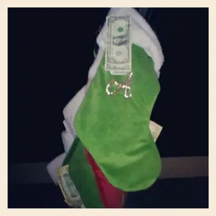 a christmas stocking filled with money