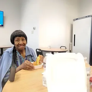 My mama inside the deli. She really enjoyed her food!