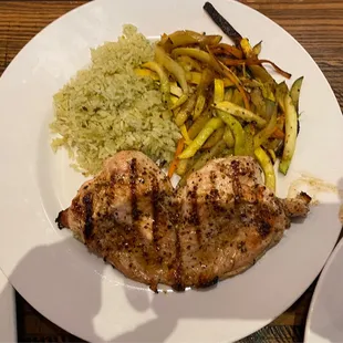 Fired roasted chicken breast with rice and zucchini