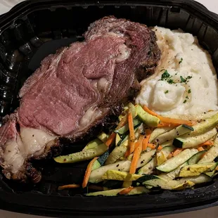 Prime Rib with Mashed Potatoes and Seasoned Vegetables. Sides were okay, but the Prime Rib was good! I recommend!