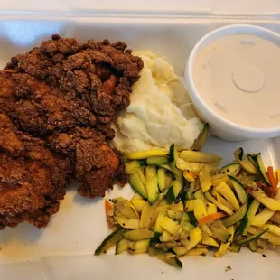 Pecan breaded chicken with mash potatoes and sauté vegetables (gravy on the side)