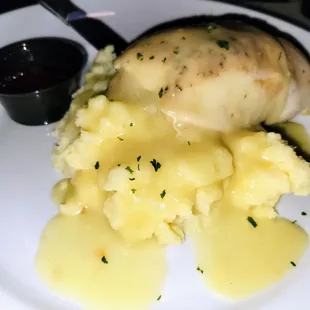 Stuffed Chicken Breast over Mashed Potatoes &amp; Gravy.  Comes w/ Corn also.