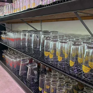 a shelf full of glasses