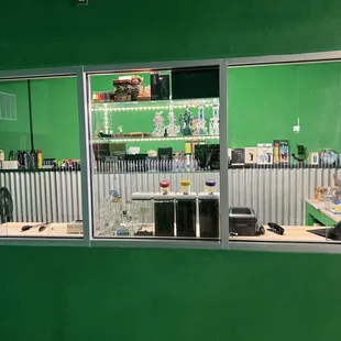 a counter with bottles and bottles of liquor