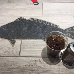 a fish and a can of soda