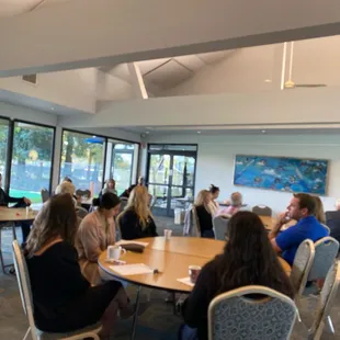 Beautiful space for a morning meeting  with views of a small lake on one side and tennis courts on the other.