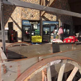 an old wagon outside of a store