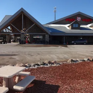 a picnic table in front of a building