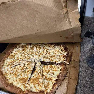 Soggy wet pizza left in the rain.