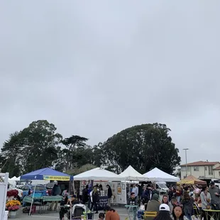 a crowd of people sitting in lawn chairs