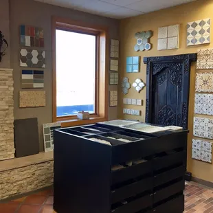 Tabarka concept boards with travertine stacked stone wall and Saltillo tile on the floor