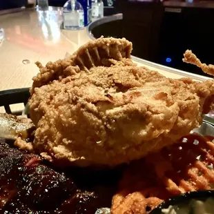 Half slab of ribs and a huge chicken breast. Sweet potato waffle fries were delicious.