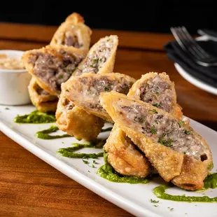 a platter of appetizers on a wooden table