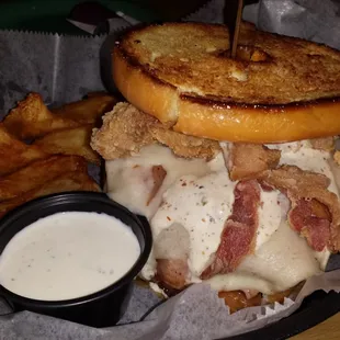 Resolution Breaker burger.  Angus rolled in black pepper, grilled ham, Swiss, fried bacon, peppercorn ranch on grilled donut.