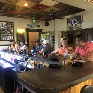 people sitting at the bar