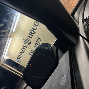 the reflection of a car's rear view mirror