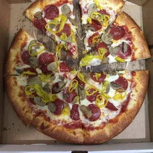 a pepperoni, mushroom, and cheese pizza