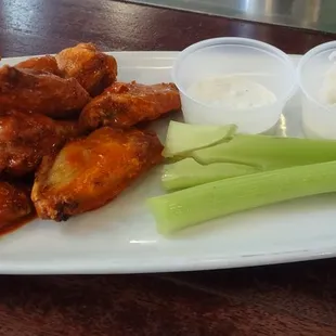Stoney's wings. Comes with half cups of blue cheese and ranch. Nice touch.